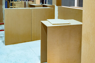 Chipboard blocks at a construction site. Construction of temporary premises. Concept - preparation of the exhibition pavilion. Concept - sale of chipboard. Sale of building materials