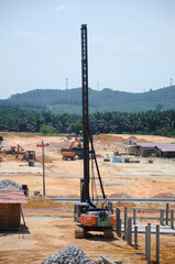 MELAKA, MALAYSIA -SEPTEMBER 18, 2016: Piling machine at the construction site. Handle manually by the workers. 
