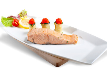 Tuna Steak. Steamed tuna on a white plate with caviar wrapped in cucumbers, lettuce, cherry tomatoes, lemon wedges.