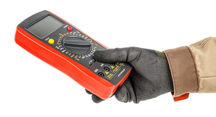 Electrician hand in black protective glove and brown uniform holding digital multimeter with red rubber protective case isolated on white background