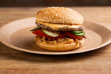 cheeseburger with beef patty, fried onions, fresh vegetables and creamy sauce