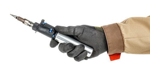 Gas soldering iron in electrician hand in black protective glove and brown uniform isolated on white background