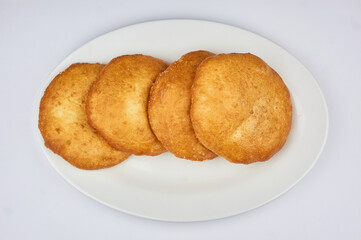 whites with meat on a white plate and white background