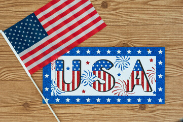 Fototapeta na wymiar Independence Day July 4th, President's Day, Memorial Day, Labor Day, Veteran's Day, Great America. USA sign in the colors of the flag of the United States on a wooden backgStates holidays celebration.