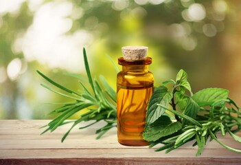 The fresh herbal and essential oil in a glass bottle