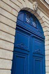 Blue wooden door  of a French mansion 