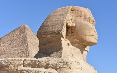 landscape  of the great sphinx  in front of  kuhfu pyramid in the blue sky.giza egypt.