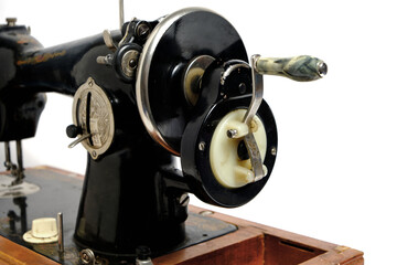 Old, retro vintage sewing machine on a white background.