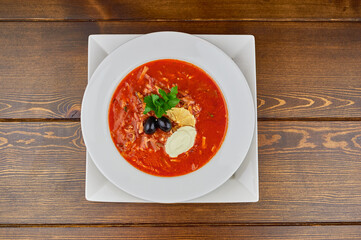 A bowl of soup sitting on top of a wooden table