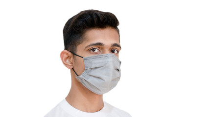 Young man looking in camera wearing face mask to protect himself from corona virus covid 19