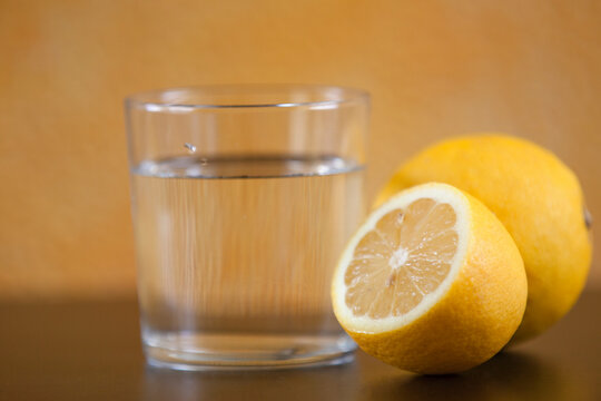 glass of water znd near fresh lemon 