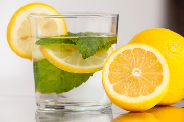 A fresh glass of water with lemon and fresh mint. Refreshing drink