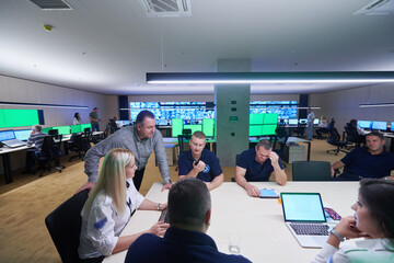 Group of security guards sitting and having briefing