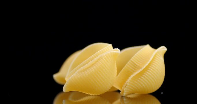 The rigati pasta dry on the table slowly rotates.