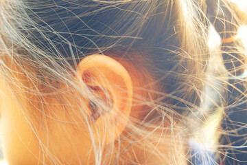 close up side of head of Asian girl