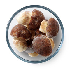 Frozen white mushrooms in a glass plate on a white background. Isolated frozen mushrooms. Top view. 