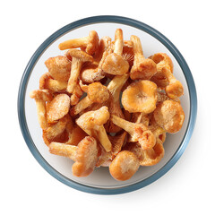 Frozen mushrooms chanterelles in a glass plate on a white background. Isolated frozen mushrooms. Top view. 