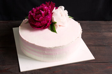 Obraz na płótnie Canvas Cake decoraited fresh peony.Wedding cake, birthday cake.Cake with flowers.
