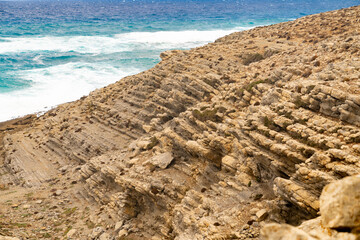 Rocky coast with stormy sea in the background