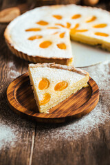 Obraz na płótnie Canvas Cut piece of sweet delicious apricot curd cake pie