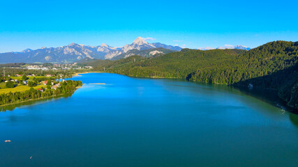 Lake Weissensee in Bavaria - beautiful small lake in the Allgau district - aerial drone footage