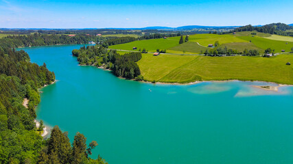 Aerial view over Lake Forggensee at the city of Fuessen in Bavaria Germany