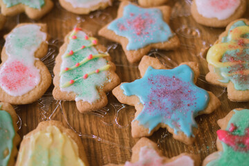 Christmas cookies on a table ready to eat..  Frosted Christmas cookies. Food