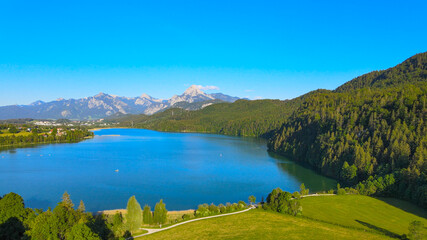 Fototapeta na wymiar Lake Weissensee in Bavaria - beautiful small lake in the Allgau district - aerial drone footage