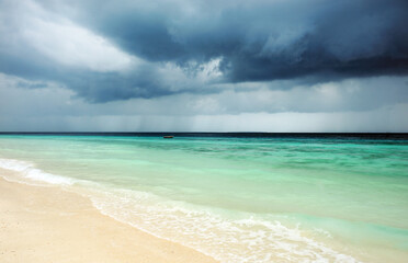 Cloudy landscape of Indian ocean sandy beach before the storm.ZANZIBAR - TANZANIA