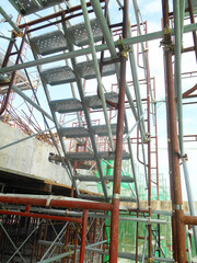 MALACCA, MALAYSIA -SEPTEMBER 23, 2016: Temporary access and staircase supported by reinforced scaffolding at the construction site. Used by construction workers.  