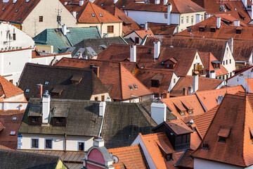 Close aerial shot of red rooftops of an old European city