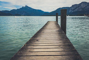 Calm lake of Mondsee in Austria, view from the wooden pier