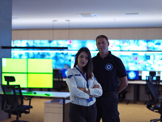 male and female operator in a security data system control room