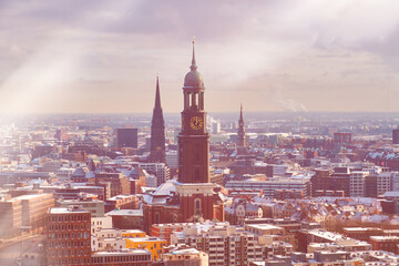 Scenic panorama view from Dancing Towers over Hamburg under snow in winter with St. Michael's...