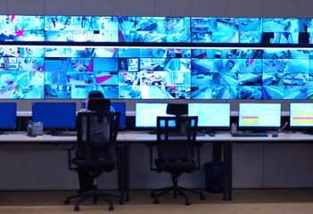 Female operator working in a security data system control room