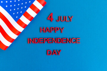 Fototapeta na wymiar American flag for Independence Day on blue 