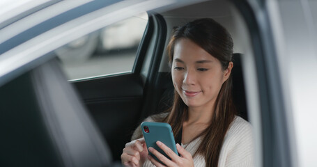 Woman use mobile phone in car