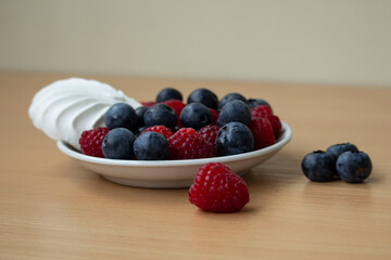 fresh berries in a bowl with marshmallow