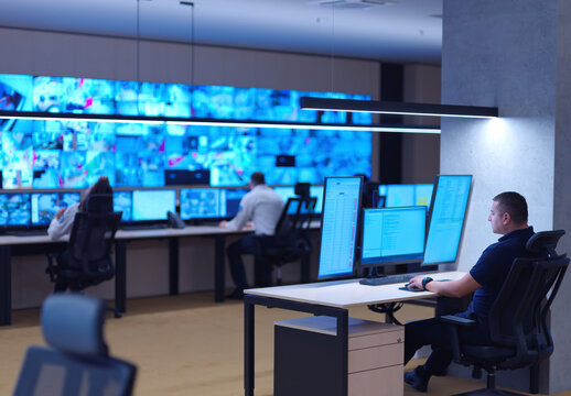 male operator working in a security data system control room