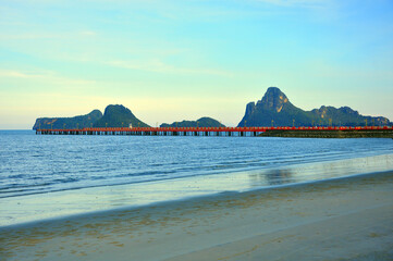 Red bridge that extends to the sea