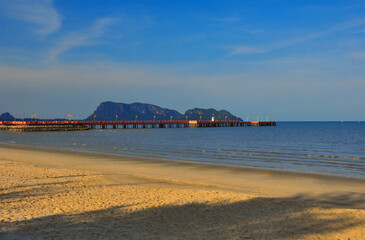 Red bridge that extends to the sea