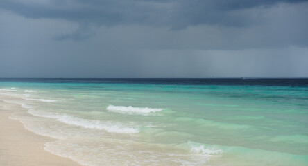 Cloudy landscape of Indian ocean sandy beach before the storm.ZANZIBAR - TANZANIA