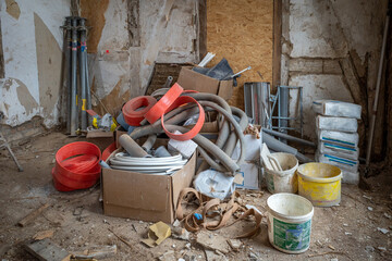 on  construction site there is a lot of waste and tools in a big pile