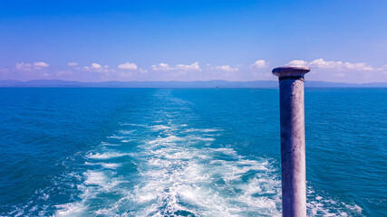 Ocean water view from the back of a ship in South Asia