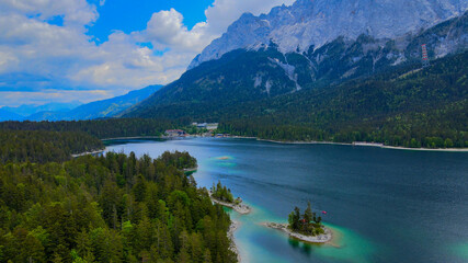 Fototapeta premium Wonderful Eibsee in Bavaria at the German Alps from above - aerial view