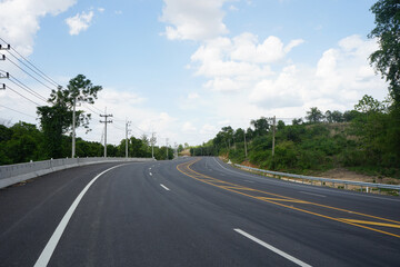 empty asphalt road in countryside of Nan Province, Thailand