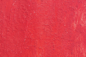 Beautiful vintage red background with old red paint with rough surface, streaks and uneven texture of red paint on old rough surface