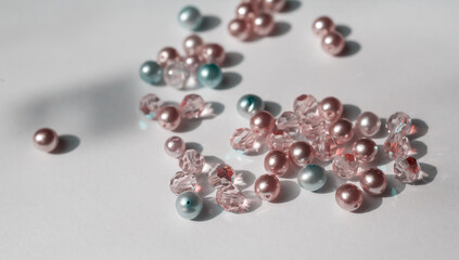 Beautiful glossy beads from pearls on white background