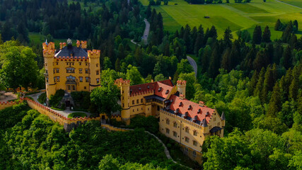 Fototapeta premium Famous Hohenschwangau Castle in Bavaria Germany, the High Castle - aerial photography