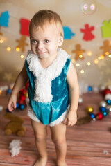 a boy in a new year's costume stands